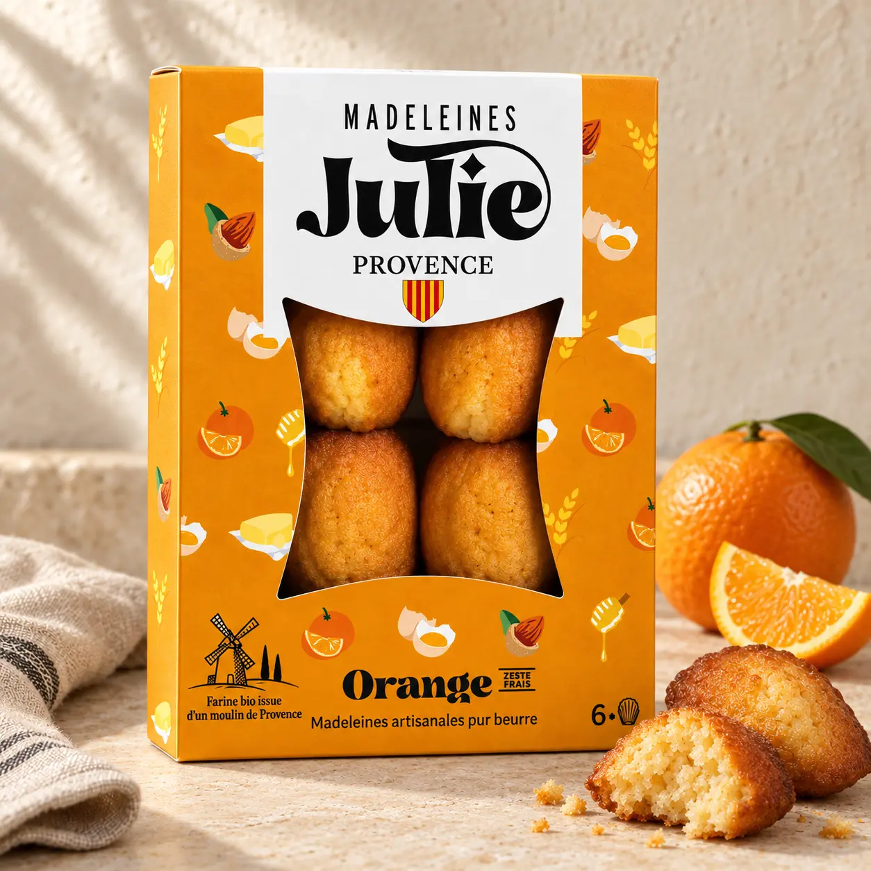 Boîte de 6 madeleines Julie à l’orange, avec blason provençal et moulin.